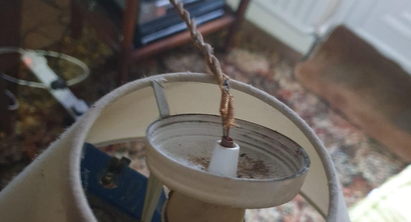 dangerous old fashioned pendant light fitting with braided cord